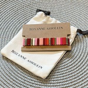 Roxanne Assoulin Enamel coated stretch bracelet with a gold tone logo